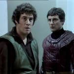 Avon stares at Blake, both in shock