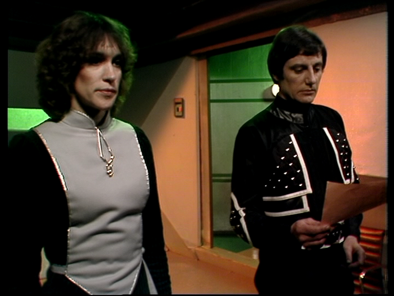 Cally and Avon standing in Cally's room