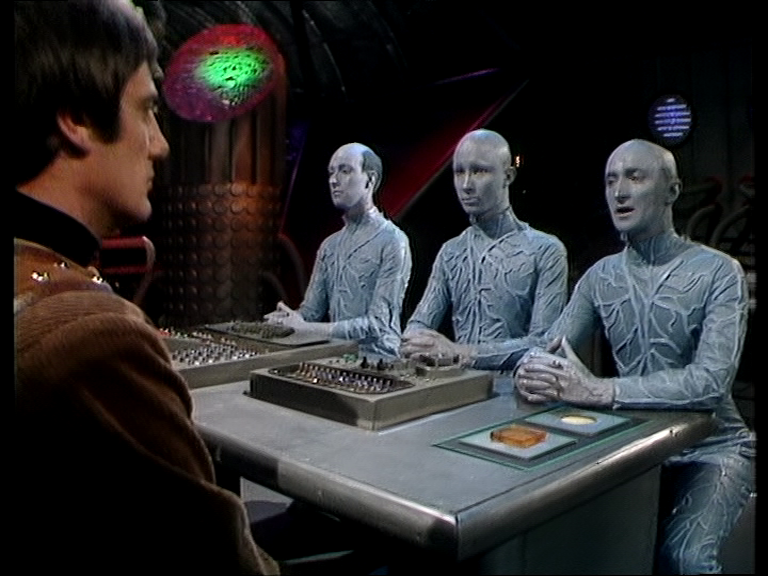 three Ultras facing Avon across a table