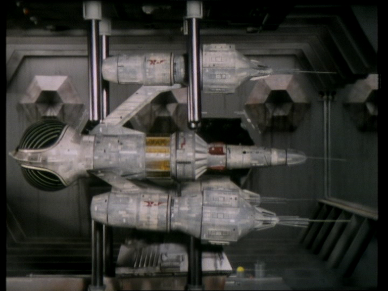 Liberator trapped by iron bars in Ultraworld's docking bay