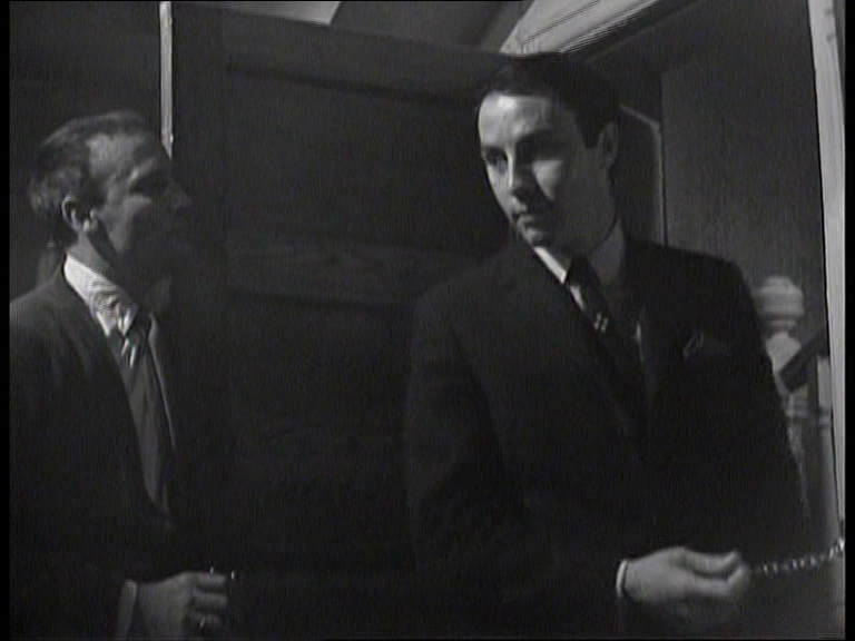 Callan holding his flat door open for Toby