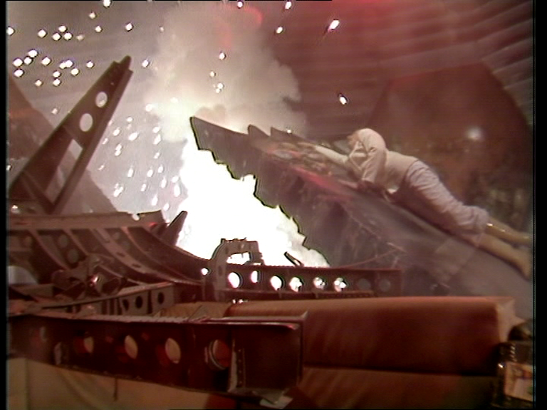 Liberator flight deck in ruins with explosion in background