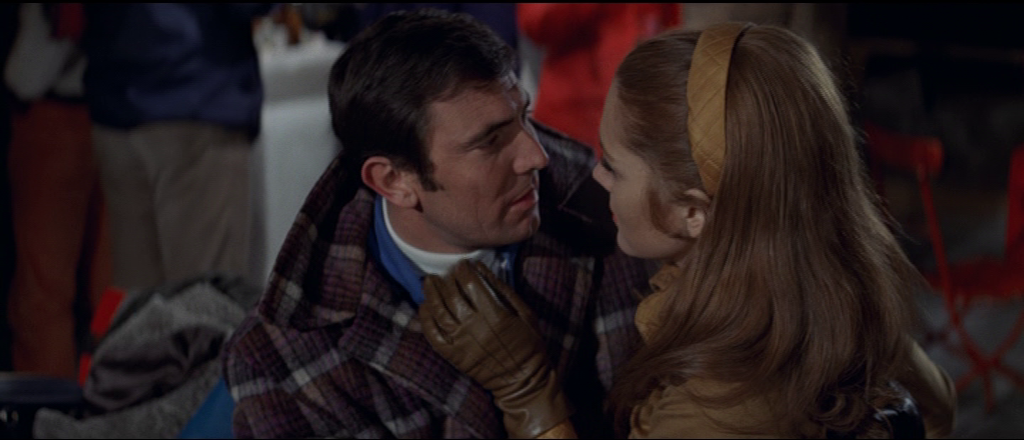 Bond and Tracy looking into each other's eyes