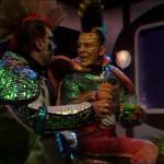 two space rats in shiny pink and green with mohicans
