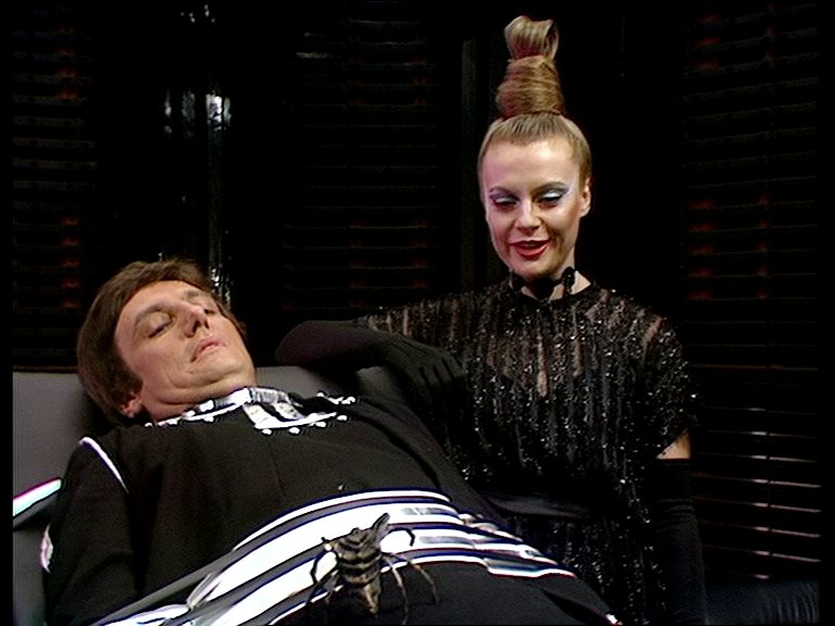 Avon tied down with Cancer watching the crab crawl up his body