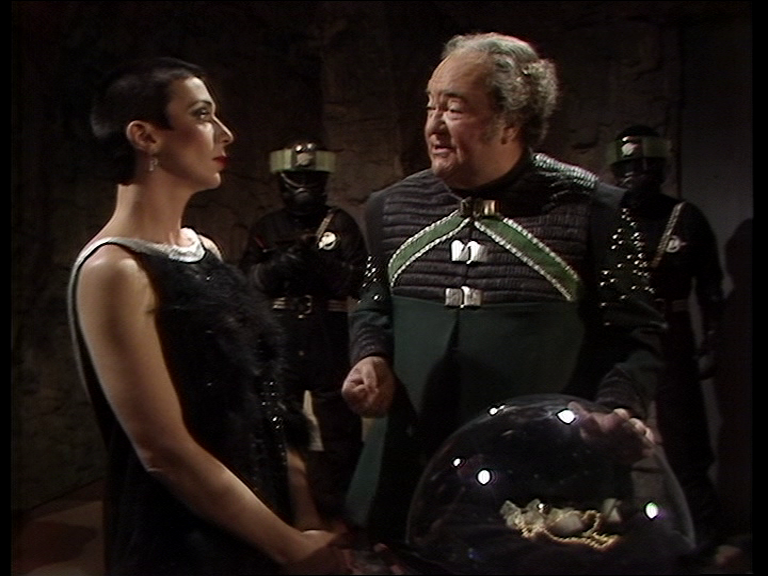 Servalan and Belkov chatting in his quarters