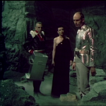 Servalan and friends on a better sand rocky set