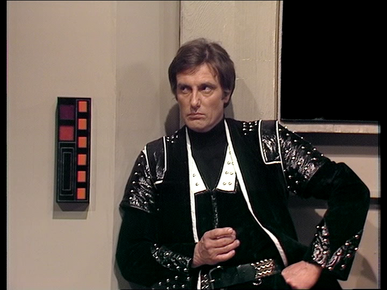 Avon leaning against a wall