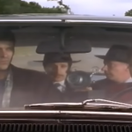 flynn pointing a ray gun at rina and harry