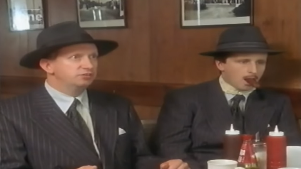 flynn sat next to the supervisor's corpse with a sausage in its mouth