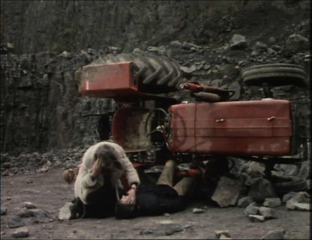 anne tends to vic while he is trapped beneath a tractor in a quarry