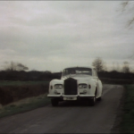 white rolls royce on country road