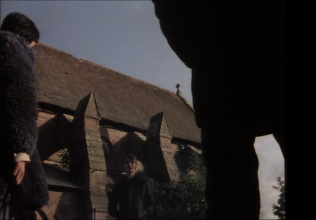 abbey greg and jenny face one another in the churchyard