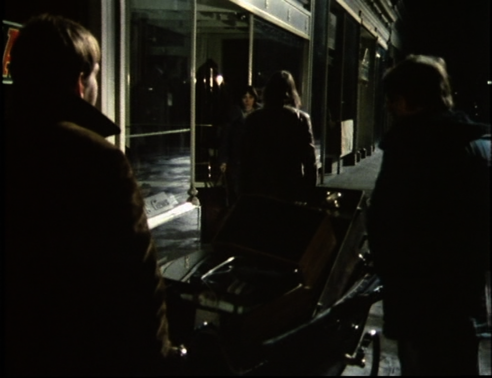 Jenny faces the looters in the dark