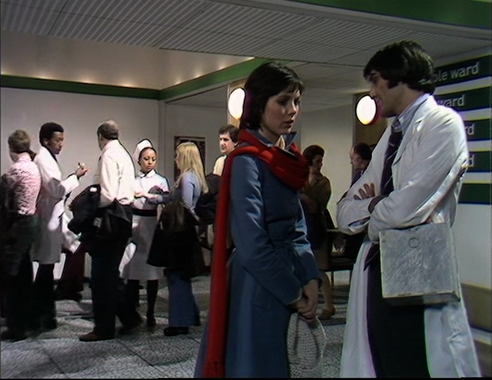 people queue for flu shots as Jenny and Andrew chat