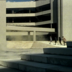 Liberator crew running across brutalist landscape
