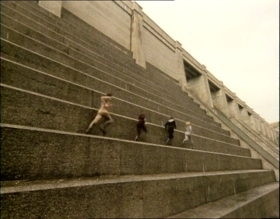 liberator crew run across large steps of reservoir dam