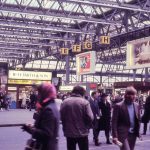 Crowds at waterloo station in 1972 with w h smiths visible in the background