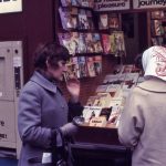 two women perusing book displays