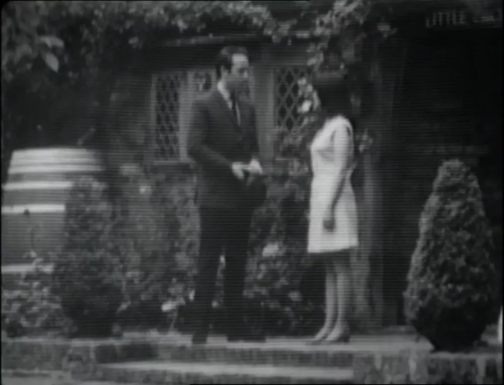 Meres and Sue stand outside the Lyalls' house.