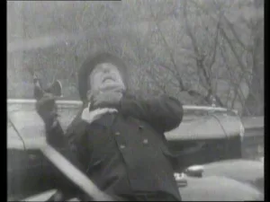 Bunin dies clutching his chest with one hand and his gun with the other
