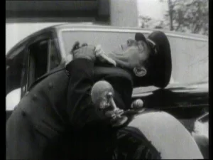 Dead Bunin slumps on the car bonnet