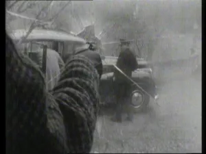 Callan fires at Bunin through the smashed glass