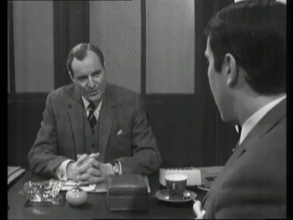 Hunters speaks to Meres across his desk